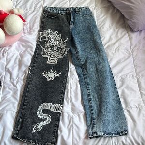 split colored dragon graphic jeans